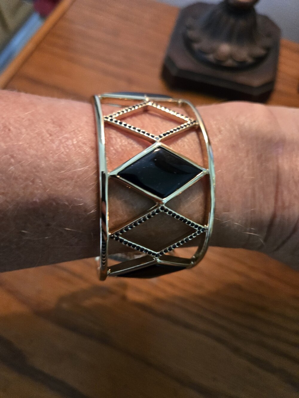 Gold Tone Openwork Cuff Bracelet with Black Inlay
